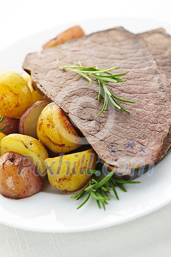Serving of roast beef and roasted potatoes meal