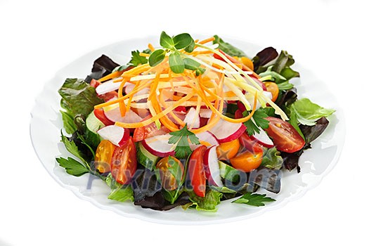 Plate of healthy green garden salad with fresh vegetables on white background