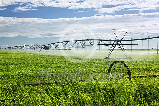 Industrial irrigation equipment on farm field in Saskatchewan, Canada