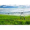 Industrial irrigation equipment on farm field in Saskatchewan, Canada