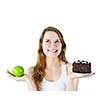 Tempted young woman holding apple and chocolate cake making a choice