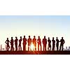 Silhouette of business people of different professions on sunset background