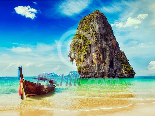 Thailand tropical vacation concept background - Vintage retro effect filtered hipster style image of long tail boat on tropical beach with limestone rock, Krabi, Thailand