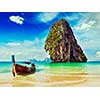 Thailand tropical vacation concept background - Vintage retro effect filtered hipster style image of long tail boat on tropical beach with limestone rock, Krabi, Thailand