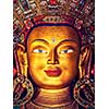 Vintage retro effect filtered hipster style image of Maitreya Buddha statue face close up in Thiksey Gompa. Ladakh, India
