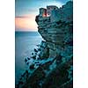 Sunset over the Old Town of Bonifacio, the limestone cliff, South Coast of Corsica Island, France