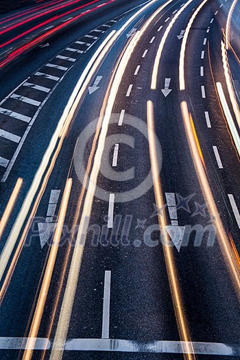 Motion blurred city road traffic (color toned image) Motion blurred city road traffic (color toned image)