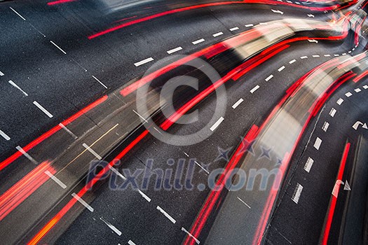 Motion blurred city road traffic (color toned  image)