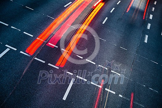 Motion blurred city road traffic (color toned image) Motion blurred city road traffic (color toned image)