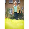 Senior woman doing some gardening in her lovely garden