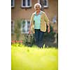 Senior woman doing some gardening in her lovely garden