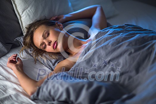 Beautiful young woman sleeping in bed (colour toned image; shallow DOF) Beautiful young woman sleeping in bed (colour toned image; shallow DOF)