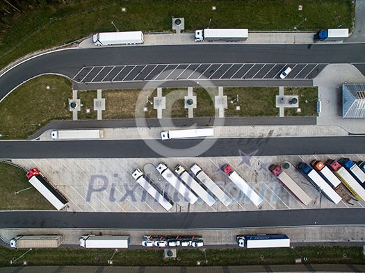 Aerial view of a highway amid fields with cars on it Aerial view of a highway amid fields with cars on it