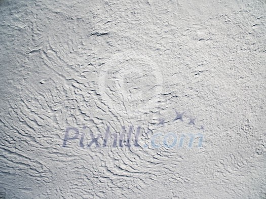 Aerial view above snowy plain on a winter frosty day Aerial view above snowy plain on a winter frosty day