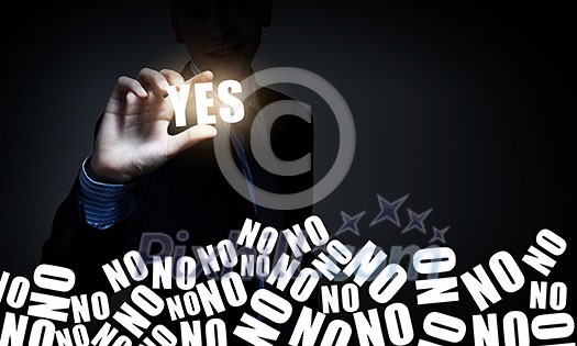 Hand of businessman taking word yes with fingers Hand of businessman taking word yes with fingers