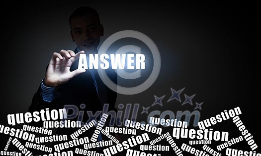 Businessman take with fingers glowing answer word on screen