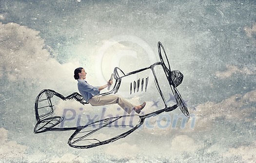Young funny woman flying in air in drawn airplane Young funny woman flying in air in drawn airplane