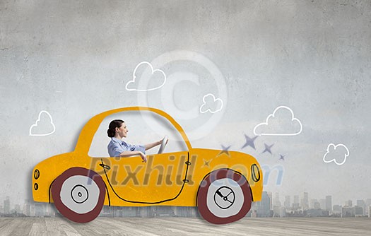 Young humorous woman driving drawn funny car Young humorous woman driving drawn funny car