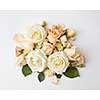 beautiful bouquet of beige roses on a white background, flat lay