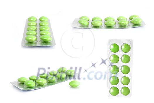 packs of green tablets isolated on white packs of green tablets isolated on white