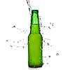 Green beer bottle with water splash isolated on white