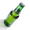 Green beer bottle with water drops isolated on white