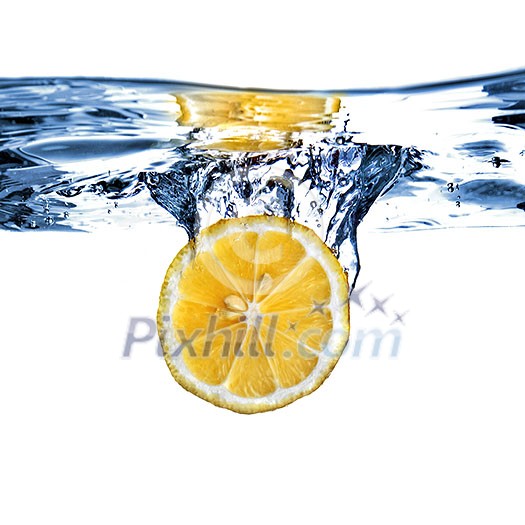 Fresh lemon dropped into water with bubbles isolated on white Fresh lemon dropped into water with bubbles isolated on white
