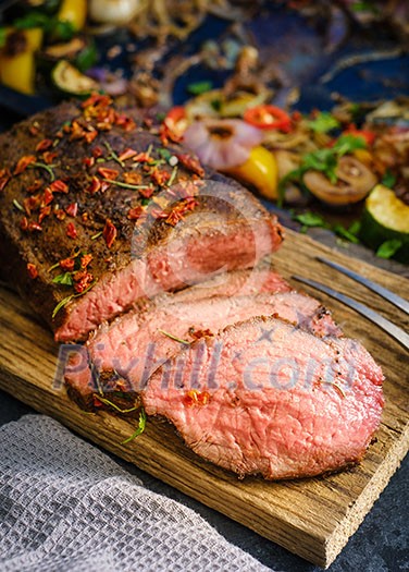 Grilled pepper steak garnished with fresh herbs. Grilled pepper steak garnished with fresh herbs.