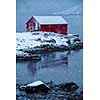 Red rorbu house in Norway in the seashore