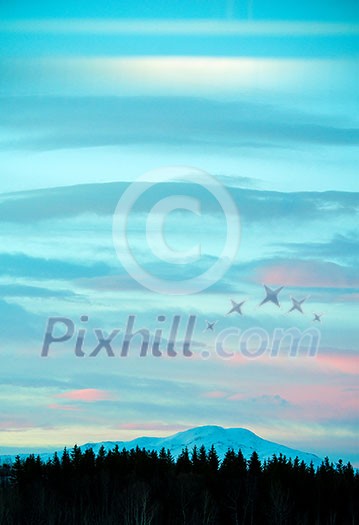 Beautiful winter sunrise in mountains. Multicolored sky over the mountains. Beautiful winter sunrise in mountains. Multicolored sky over the mountains.