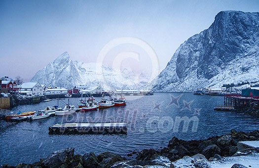 Cold and snowy winter morning in Hamnoy, with houses, boats and mountains. Cold and snowy winter morning in Hamnoy, with houses, boats and mountains.