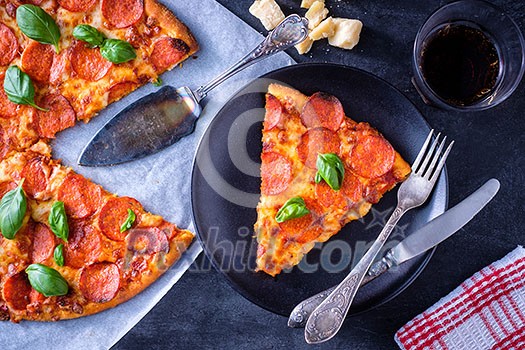 Homemade Pepperoni Pizza served on plate. Top view. Homemade Pepperoni Pizza served on plate. Top view.