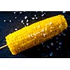 Boiled fresh corn with salt on the table