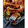 Roasted sliced barbecue pork ribs, seasoned with a spicy basting sauce and served with vegetables
