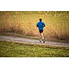 Young man running outdoors on a lovely sunny day