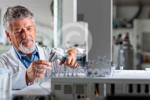 Senior chemistry professor/doctor in a lab (color toned image) Senior chemistry professor/doctor in a lab (color toned image)