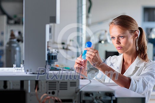 Portrait of a female researcher doing research in a lab, using a tablet computer for data collection and visualization(shallow DOF; color toned image) Portrait of a female researcher doing research in a lab, using a tablet computer for data collection and visualization(shallow DOF; color toned image)