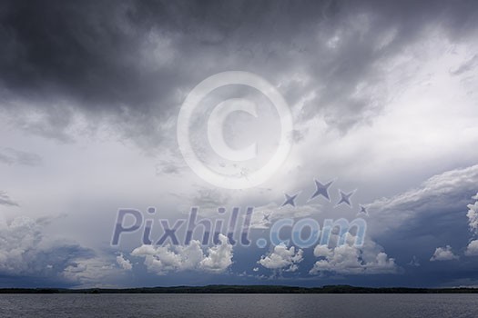 Dark rain clouds over water Dark rain clouds over water