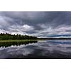 Dark rain clouds over water