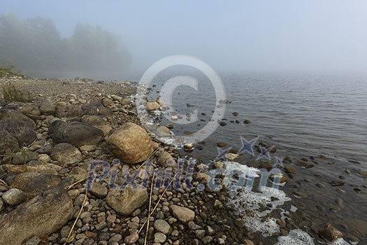 Foggy lake scenery in september Foggy lake scenery in september