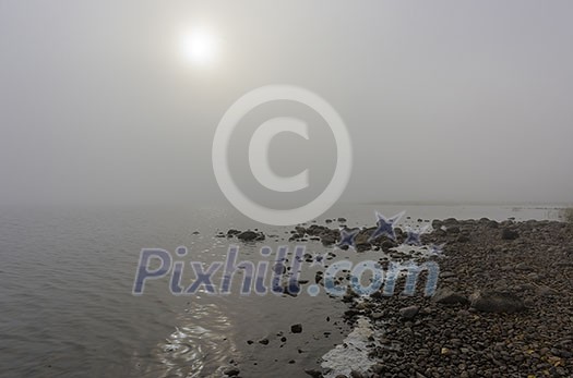 Foggy lake scenery in september Foggy lake scenery in september