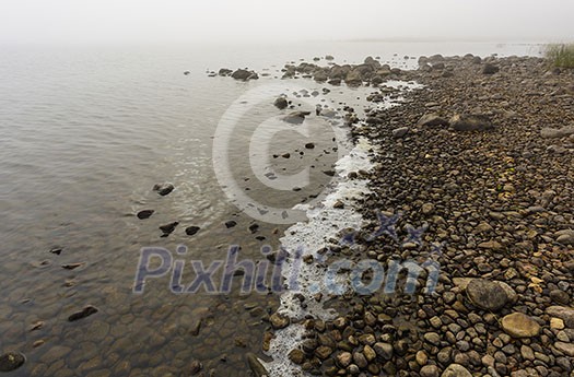 Foggy lake scenery in september Foggy lake scenery in september