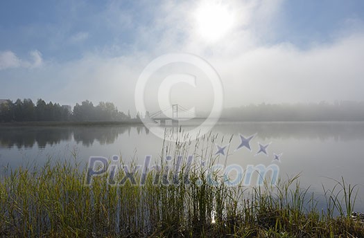 Foggy lake scenery in september