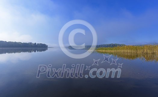 Foggy lake scenery in september