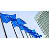 European Union flags in front of the Berlaymont building in Brussels, Belgium.