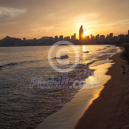 Golden sunset in the Poniente beach in Benidorm, Spain Golden sunset in the Poniente beach in Benidorm, Spain