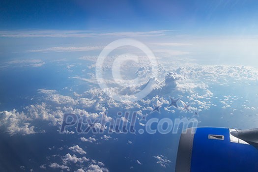 Clouds and sky as seen through window of an aircraft,