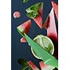 watermelon and lime slices with knife on a plate