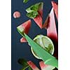 watermelon and lime slices with knife on a plate