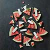 watermelon slices with cottage cheese on a black concrete background , top view